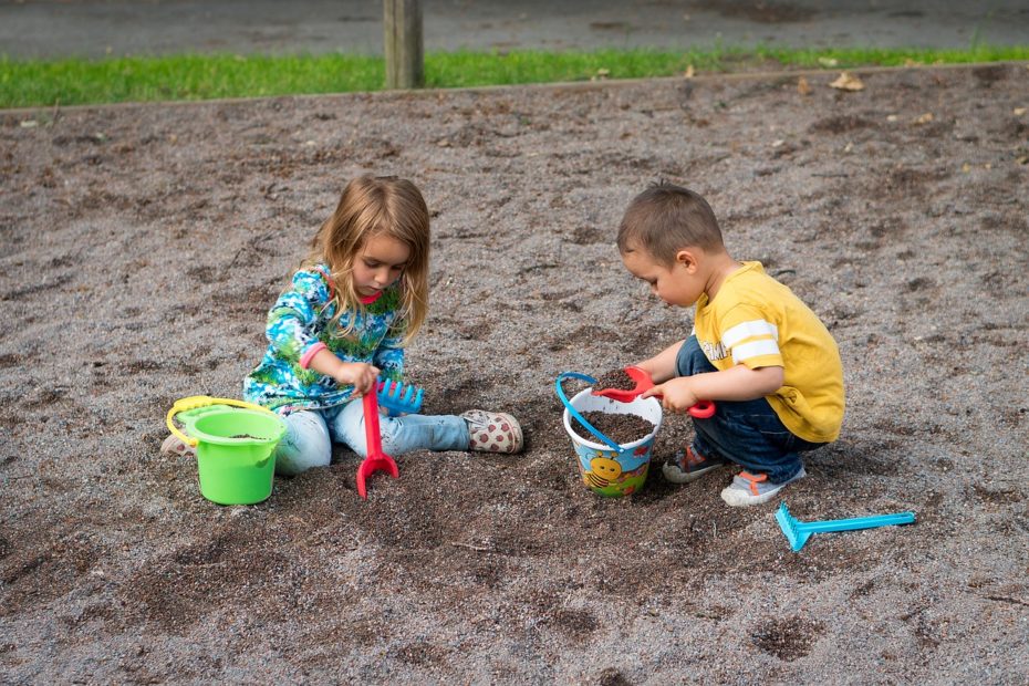 two kids in a sandbox